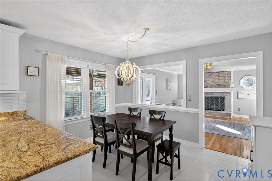7443 Pinehurst Drive Quinton, VA 23141 - Photo 20 of 49 a view of a dining room with furniture window and wooden floor