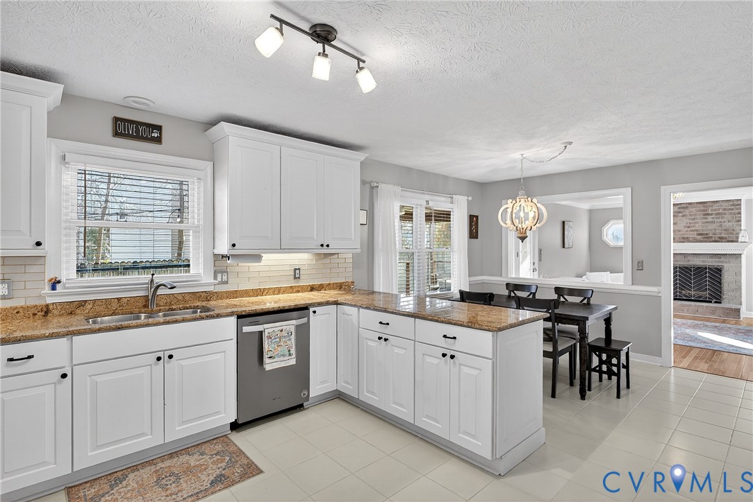 7443 Pinehurst Drive Quinton, VA 23141 - Photo 22 of 49 a open kitchen with center island and stainless steel appliances