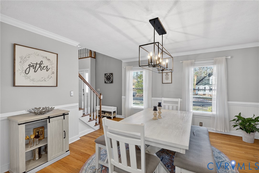 7443 Pinehurst Drive Quinton, VA 23141 - Photo 26 of 49 a dining room with wooden floor and large windows