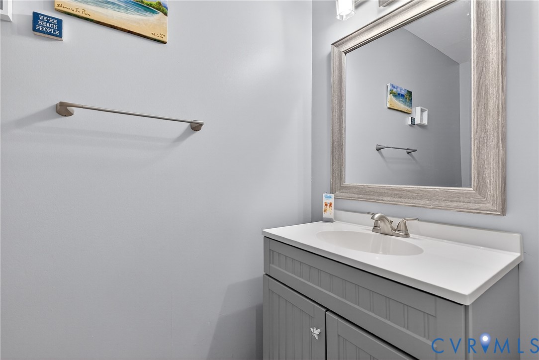 7443 Pinehurst Drive Quinton, VA 23141 - Photo 28 of 49 a bathroom with a sink vanity and a mirror