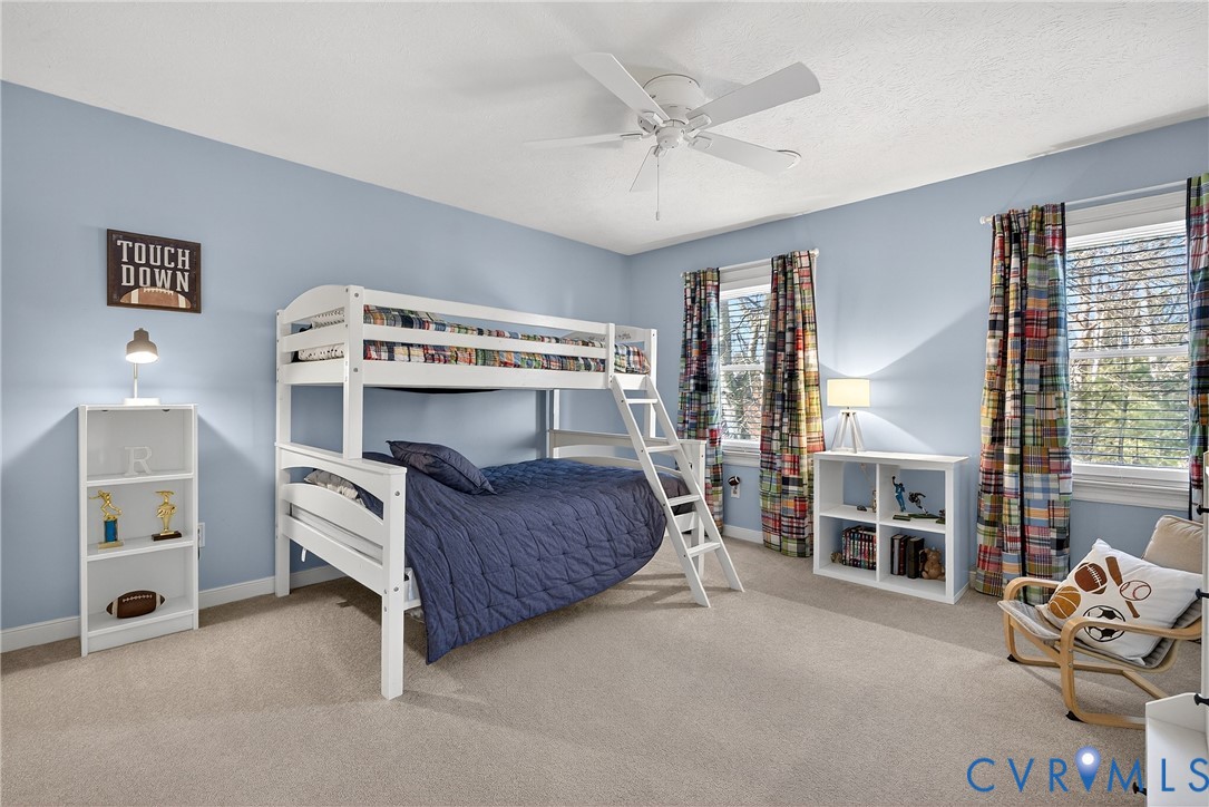 7443 Pinehurst Drive Quinton, VA 23141 - Photo 29 of 49 a living room with a bed furniture and a window