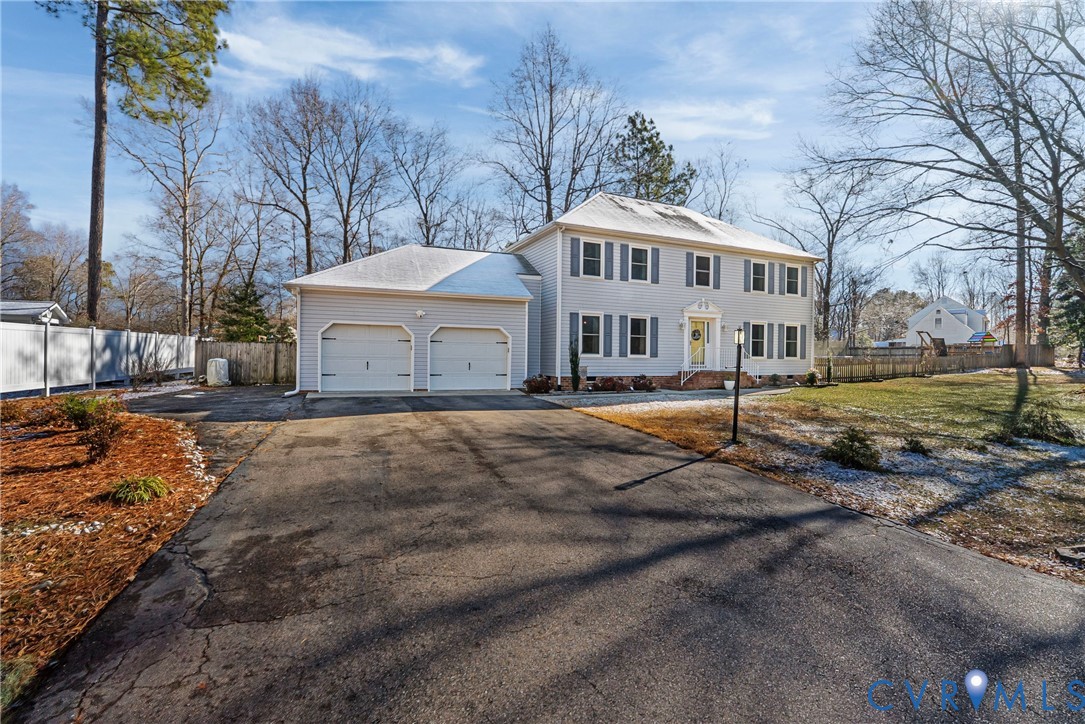 7443 Pinehurst Drive Quinton, VA 23141 - Photo 3 of 49 a front view of a house with a yard