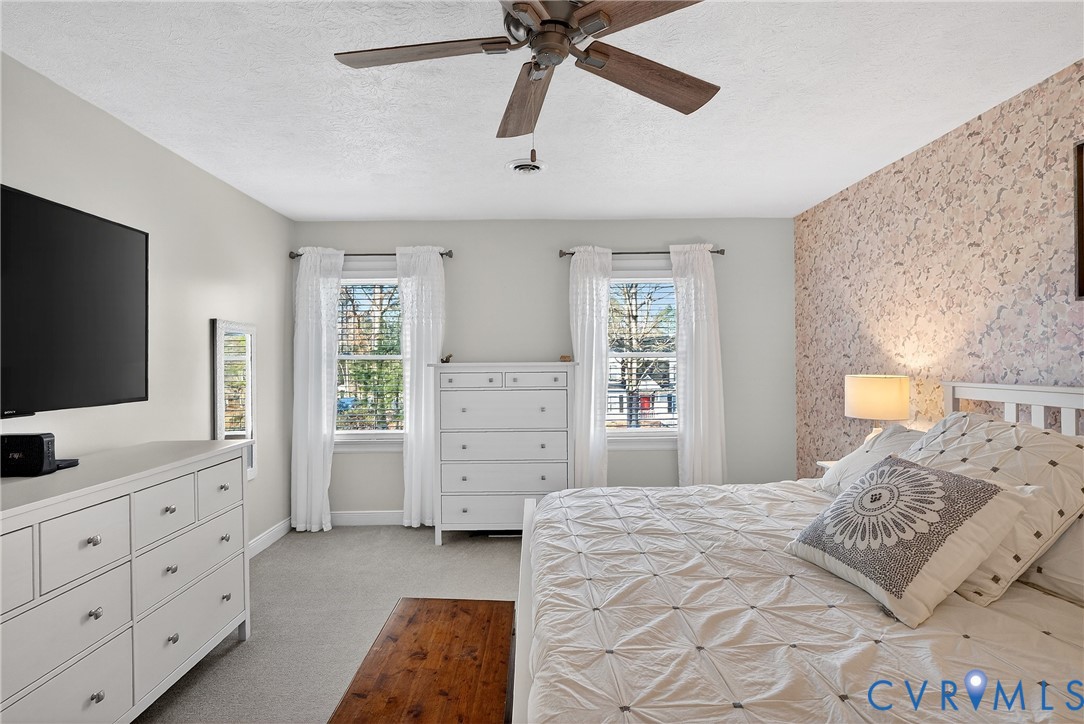 7443 Pinehurst Drive Quinton, VA 23141 - Photo 36 of 49 a bedroom with a bed and a flat screen tv