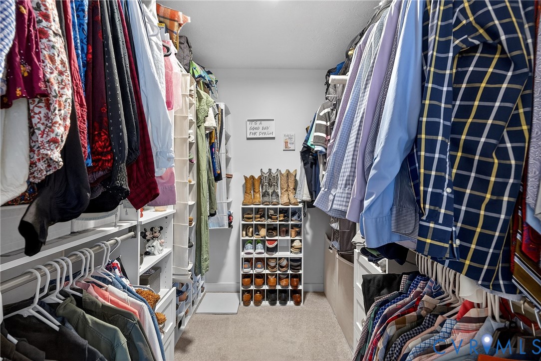 7443 Pinehurst Drive Quinton, VA 23141 - Photo 41 of 49 walk in closet with clothes and shoes