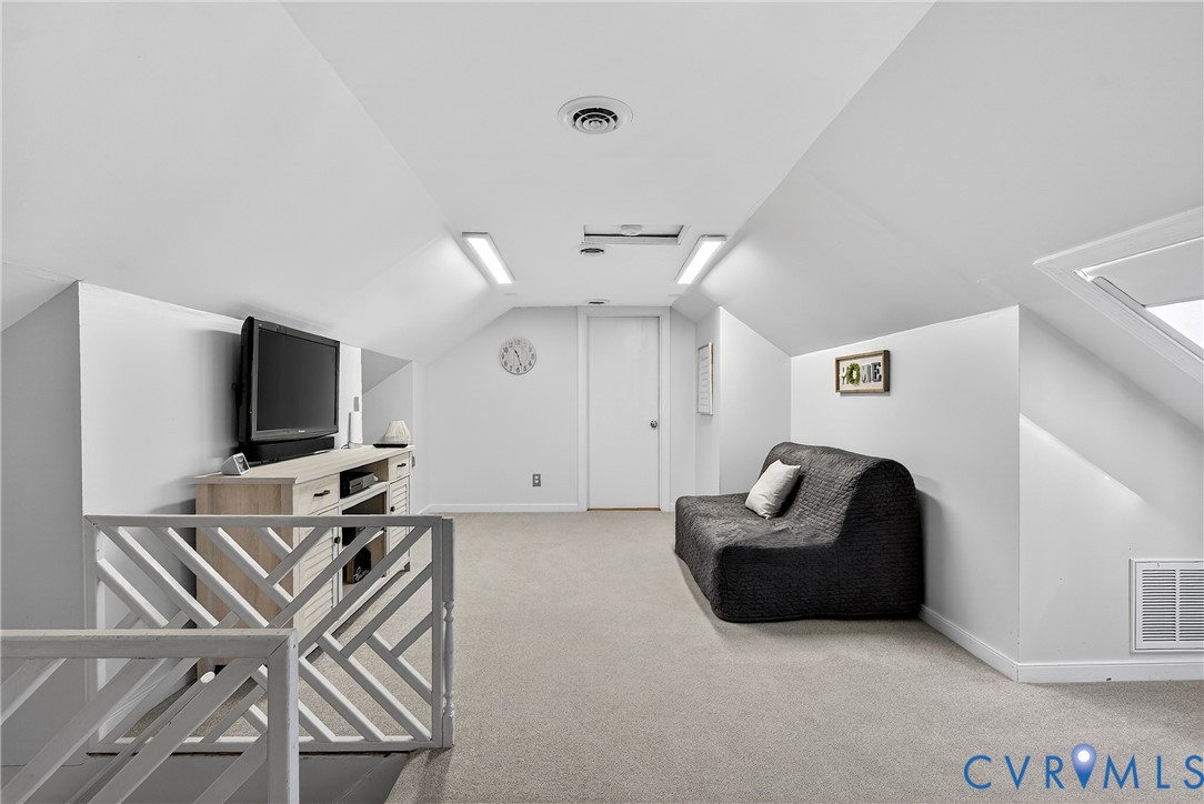 7443 Pinehurst Drive Quinton, VA 23141 - Photo 42 of 49 a living room with furniture and a flat screen tv