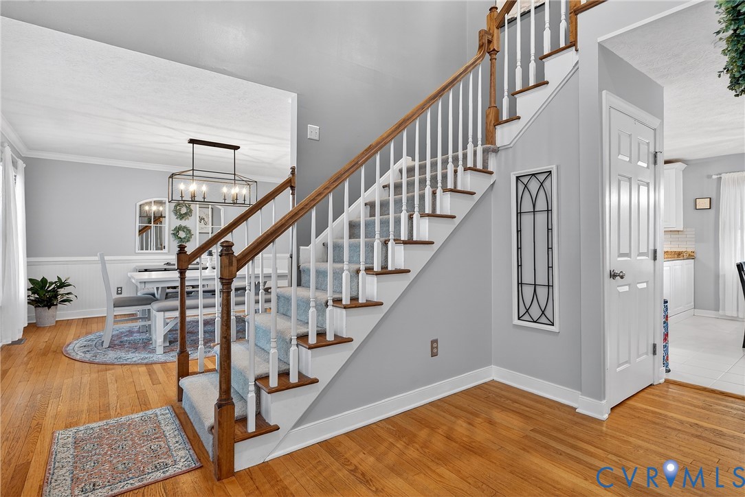 7443 Pinehurst Drive Quinton, VA 23141 - Photo 5 of 49 a view of entryway and hall with wooden floor