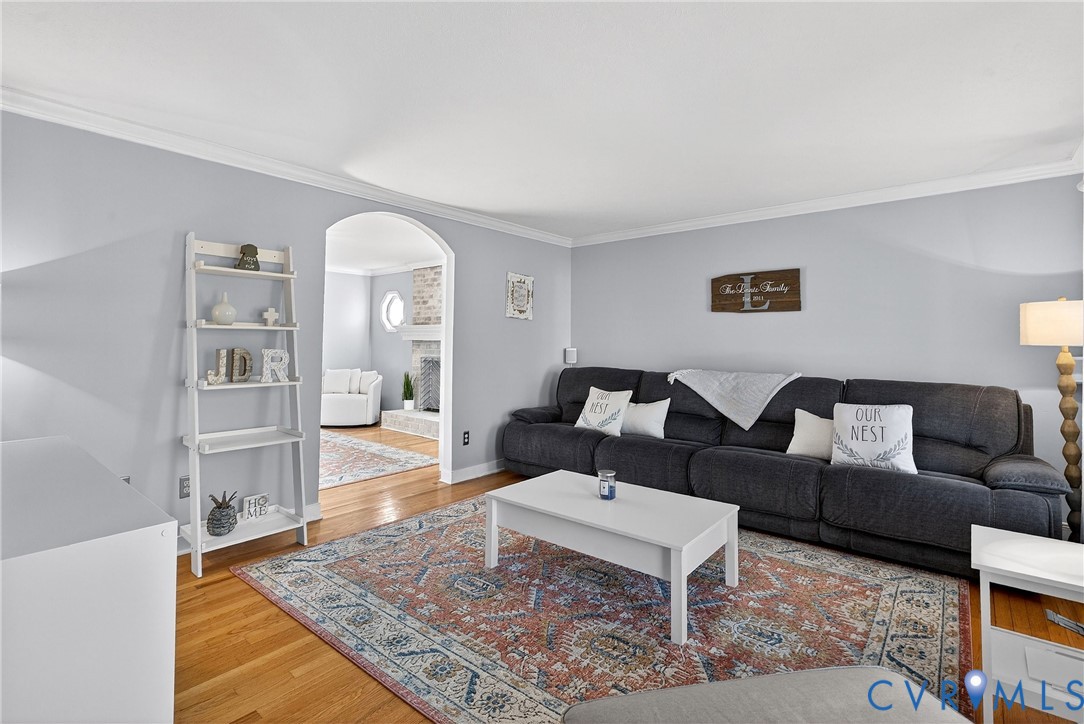 7443 Pinehurst Drive Quinton, VA 23141 - Photo 7 of 49 a living room with furniture and a rug