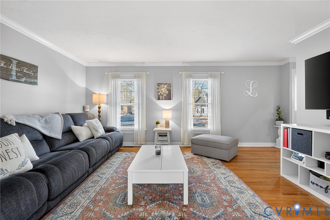 7443 Pinehurst Drive Quinton, VA 23141 - Photo 9 of 49 a living room with furniture a flat screen tv and a couch
