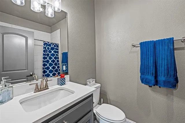 a view of a room with cabinet ceiling fan