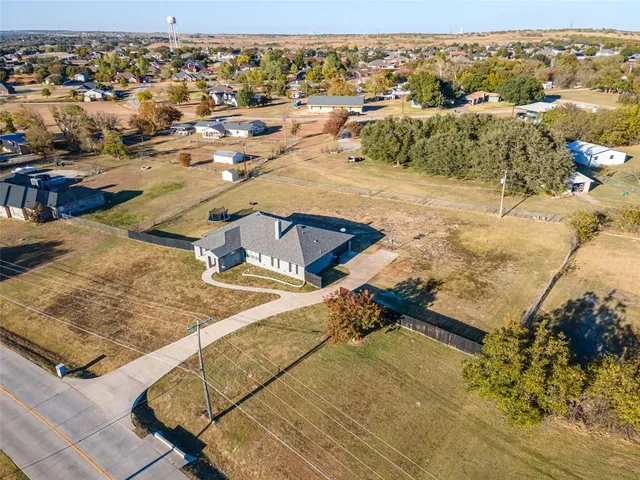 a view of a house with swimming pool and sitting area