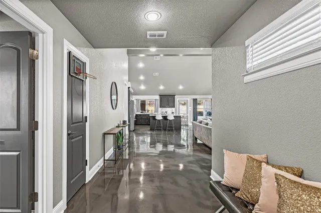 a view of a dining room with furniture a chandelier