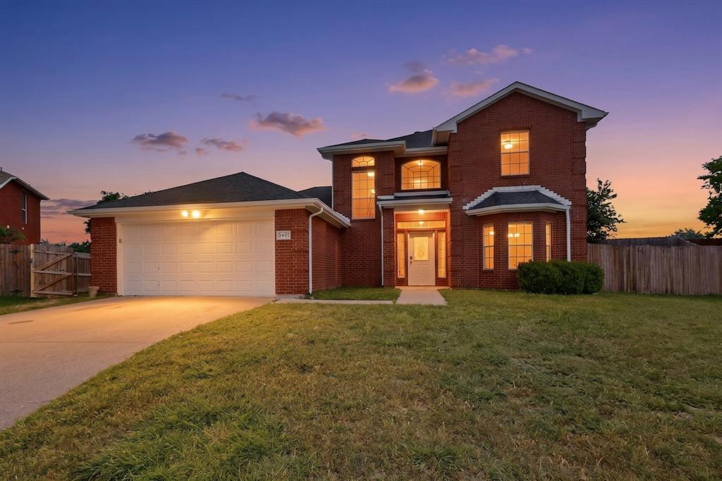 3401 Newgate Street Midlothian, TX 76065 - Photo 1 of 34 Two-story brick exterior featuring a white paneled garage door, a covered entry with a white front door, multiple arched windows, and a bay window detail