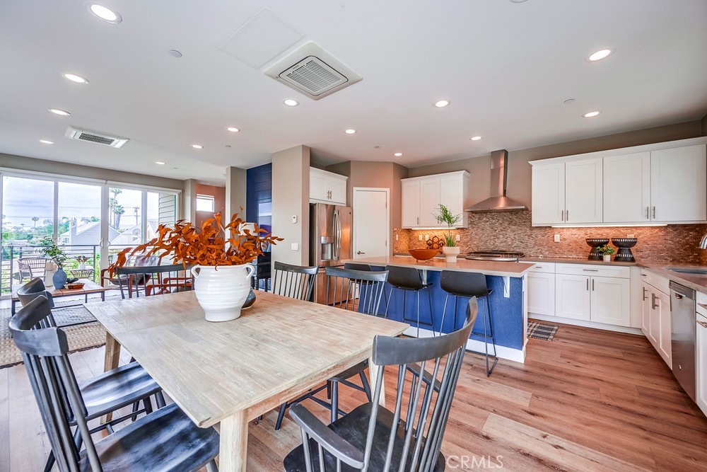 2125 Evans Way Costa Mesa, CA 92627 - Photo 16 of 41 a kitchen with a dining table chairs and kitchen view