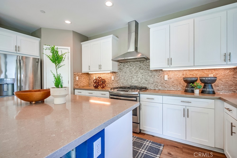 2125 Evans Way Costa Mesa, CA 92627 - Photo 18 of 41 a kitchen with stainless steel appliances a sink a stove a refrigerator and cabinets