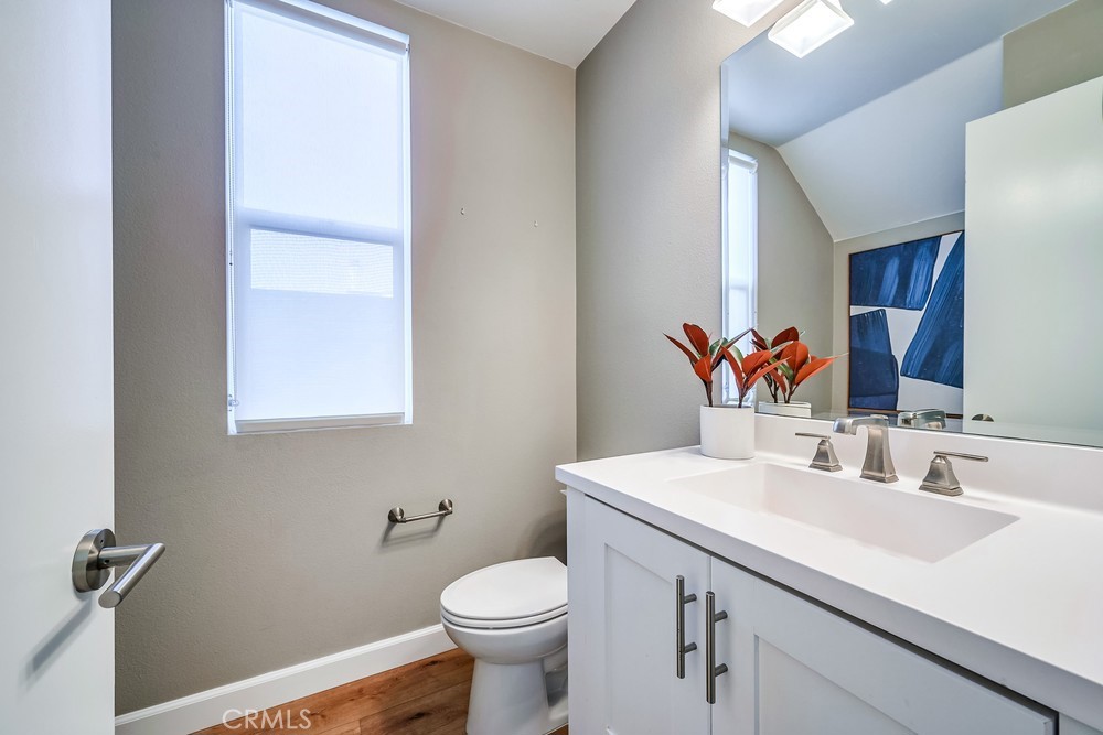 2125 Evans Way Costa Mesa, CA 92627 - Photo 20 of 41 a bathroom with a sink toilet and mirror