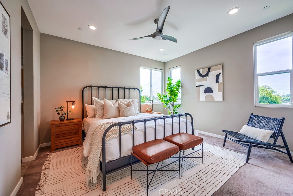 2125 Evans Way Costa Mesa, CA 92627 - Photo 22 of 41 a bedroom with a bed and a chair