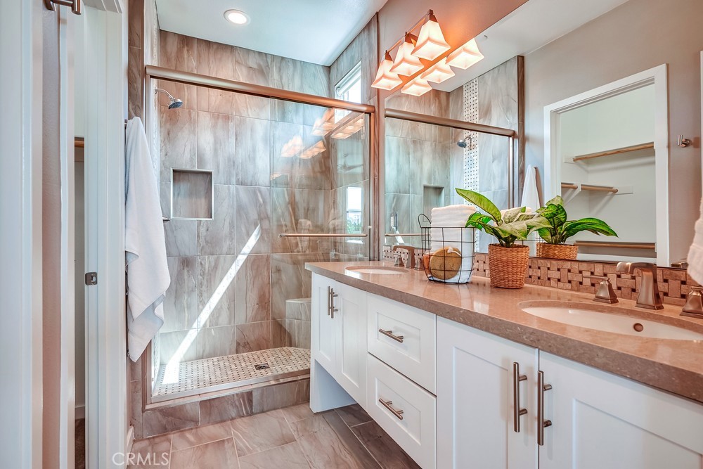 2125 Evans Way Costa Mesa, CA 92627 - Photo 24 of 41 a bathroom with a double vanity sink and a large mirror