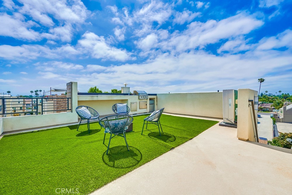 2125 Evans Way Costa Mesa, CA 92627 - Photo 33 of 41 a view of a swimming pool with a garden