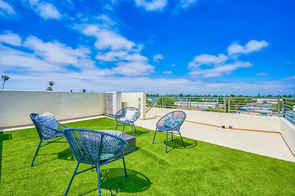 2125 Evans Way Costa Mesa, CA 92627 - Photo 35 of 41 a patio with table and chairs