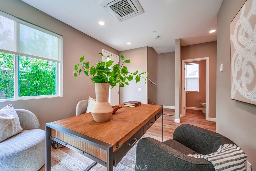 2125 Evans Way Costa Mesa, CA 92627 - Photo 6 of 41 a living room with furniture and a potted plant