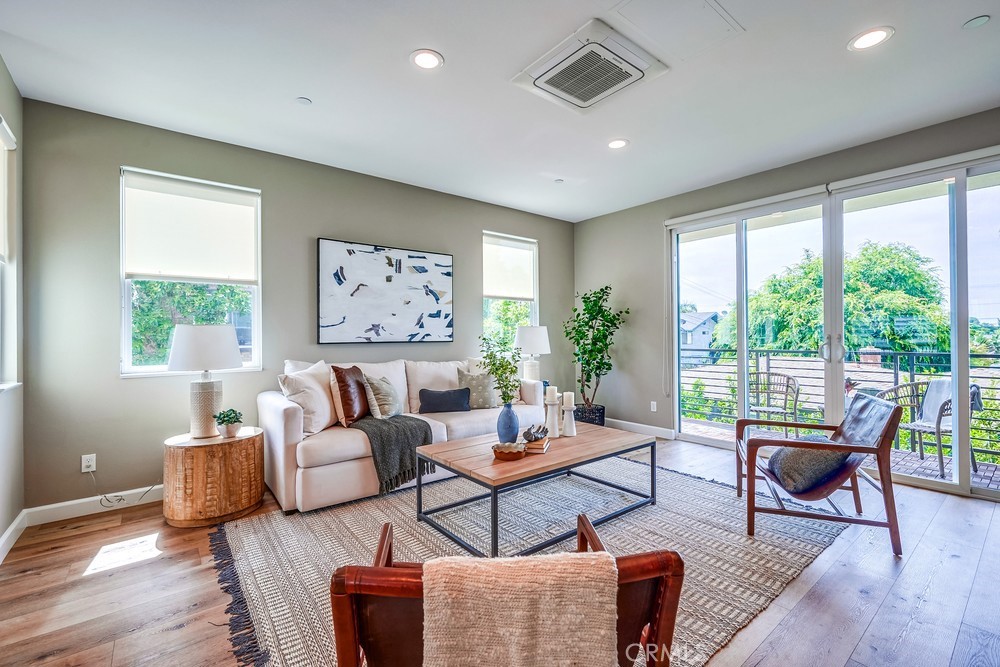 2125 Evans Way Costa Mesa, CA 92627 - Photo 9 of 41 a living room with furniture and a large window
