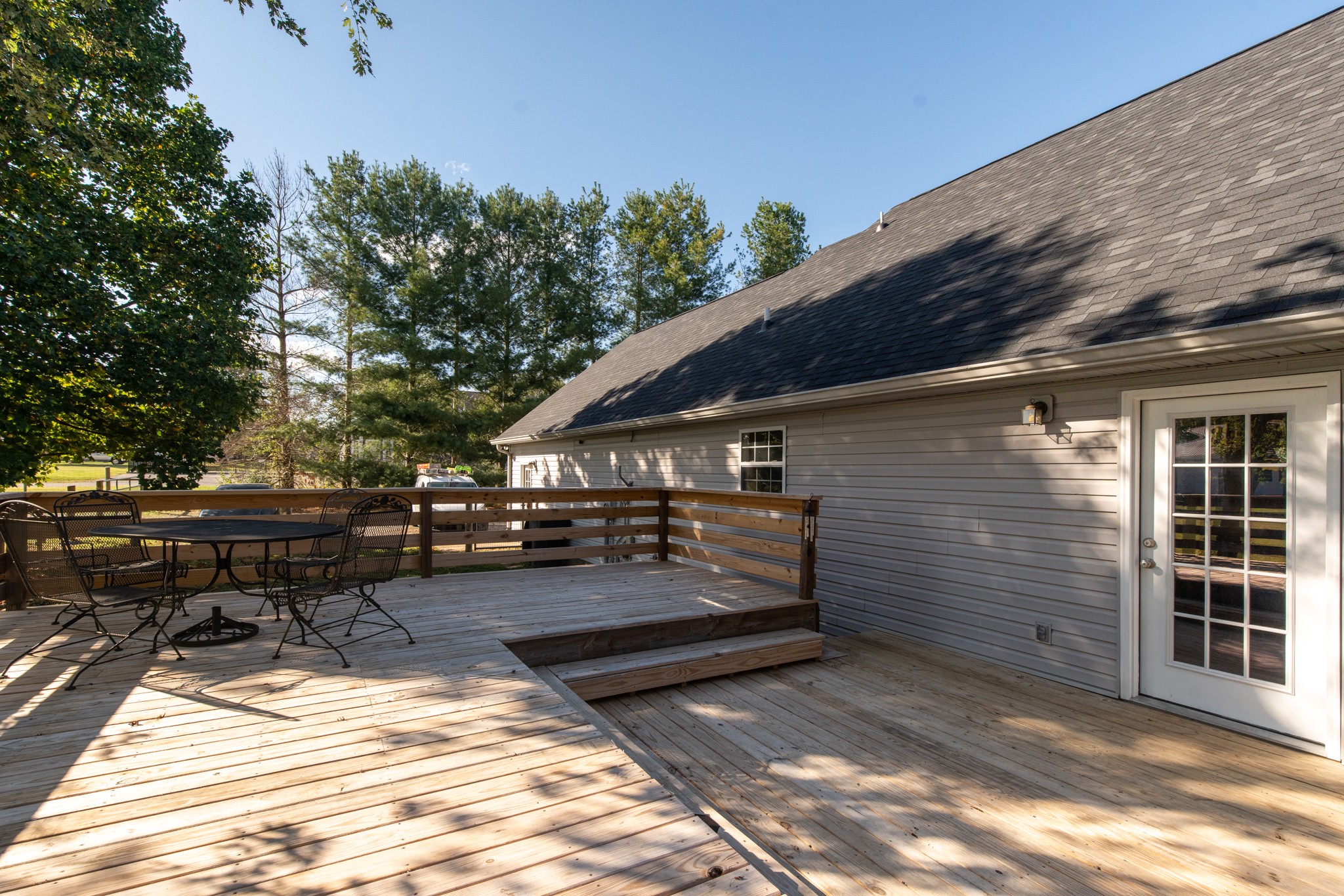 6699 East Benton Road Springfield, TN 37172 - Photo 12 of 66 a backyard of a house with barbeque oven and outdoor seating