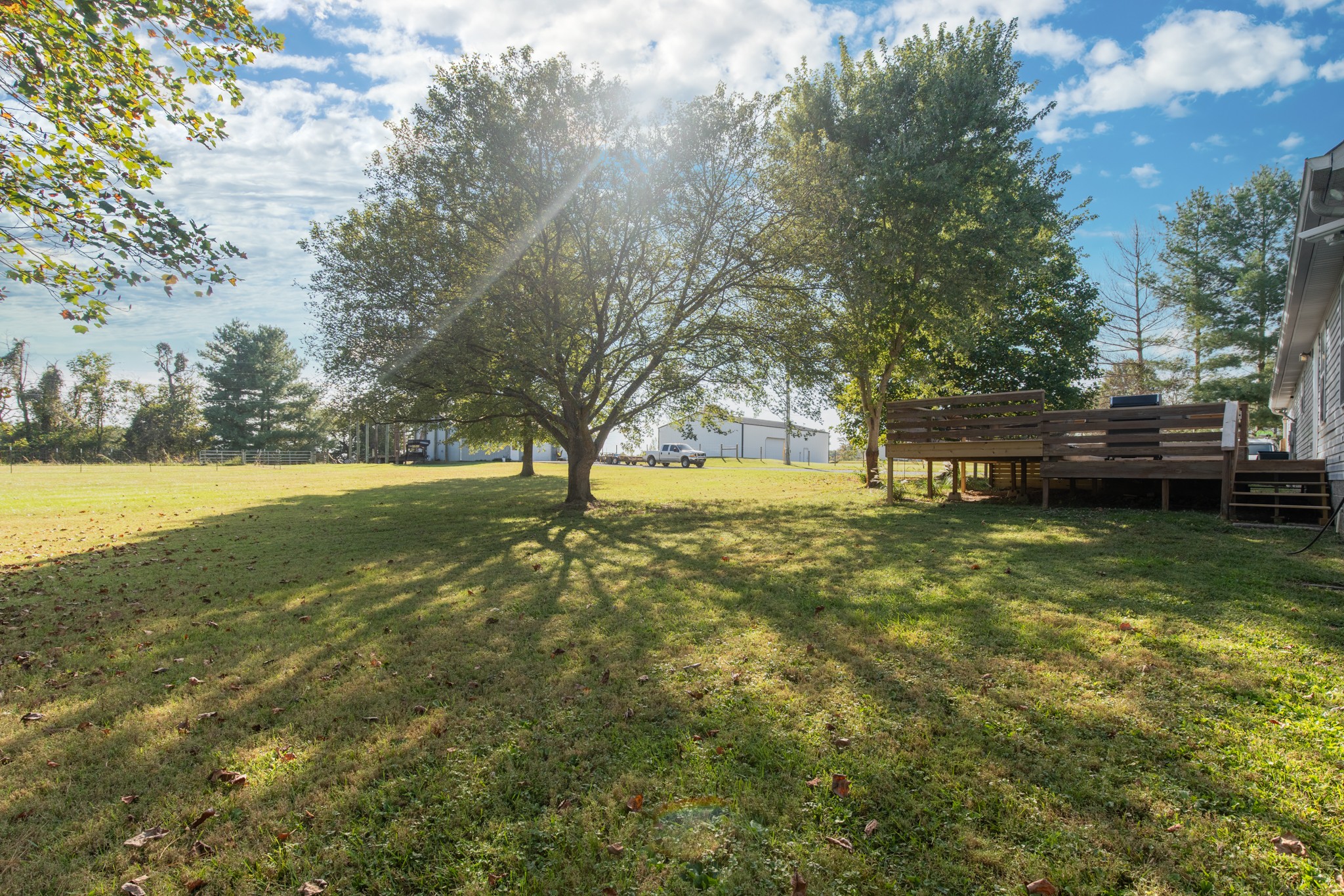 6699 East Benton Road Springfield, TN 37172 - Photo 15 of 66 a view of outdoor space with deck and yard