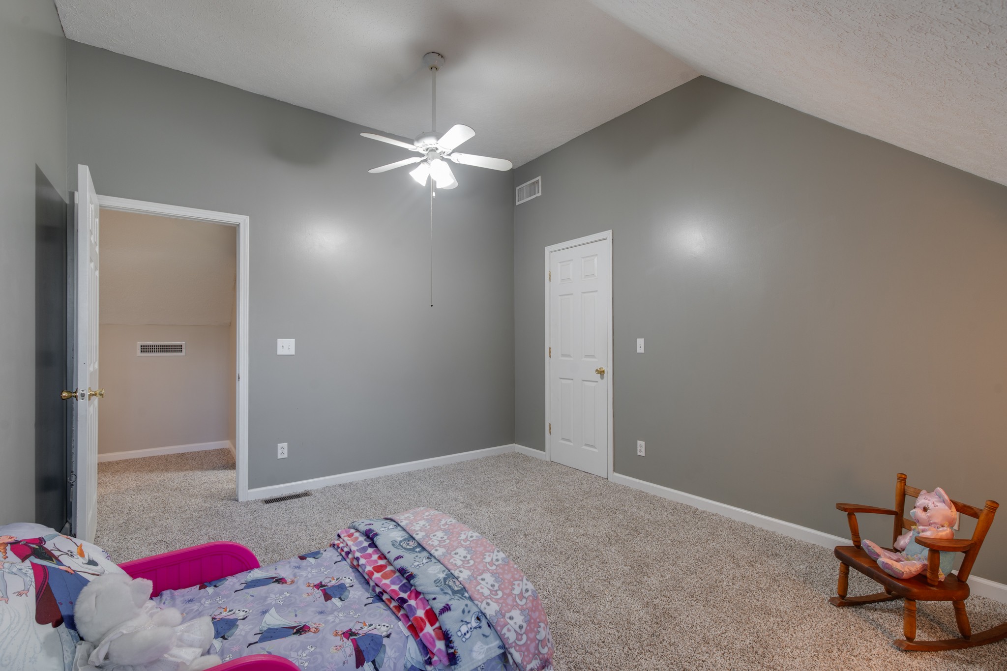 6699 East Benton Road Springfield, TN 37172 - Photo 20 of 66 a bedroom with a bed and a chandelier