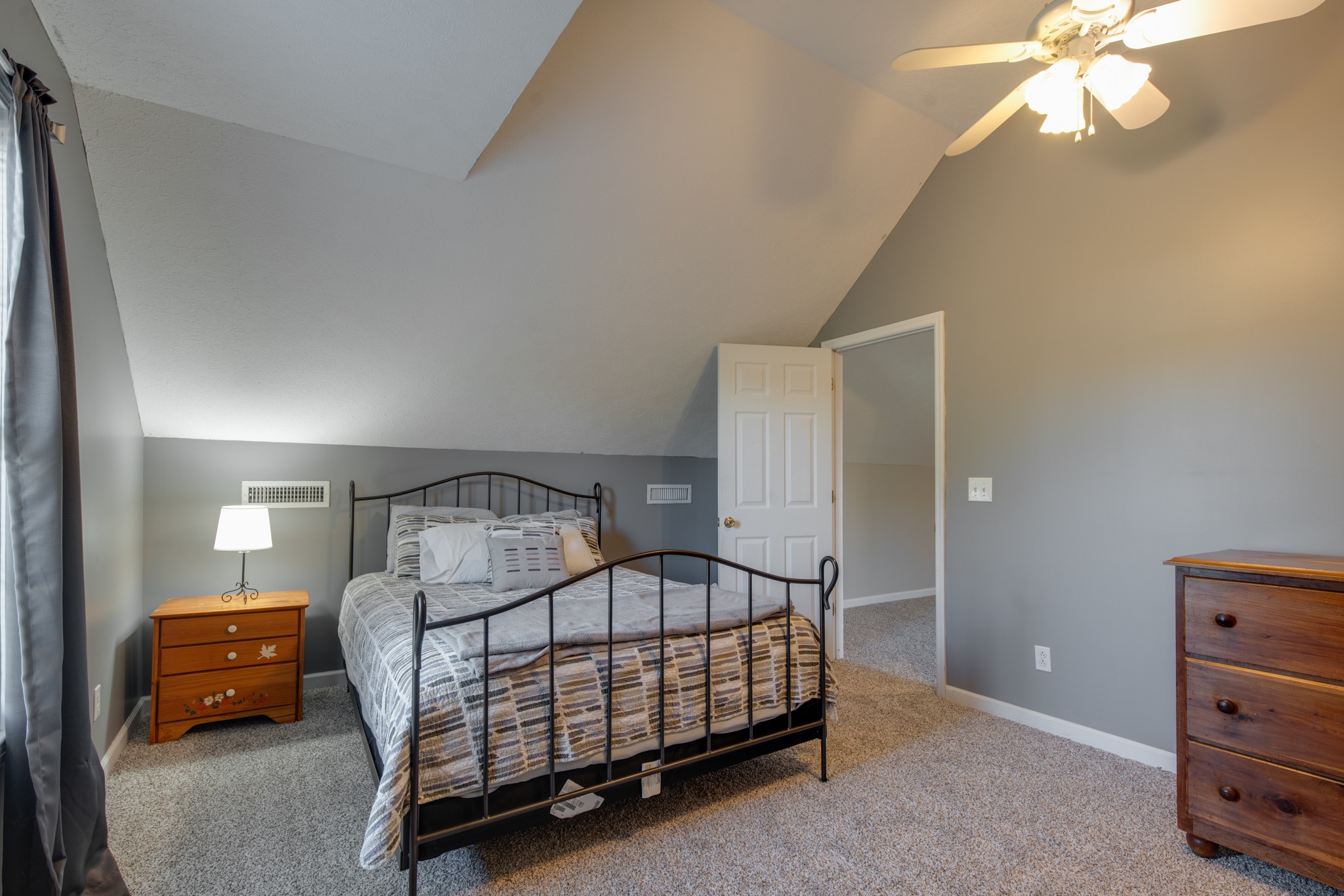 6699 East Benton Road Springfield, TN 37172 - Photo 28 of 66 a bedroom with a bed and a chandelier