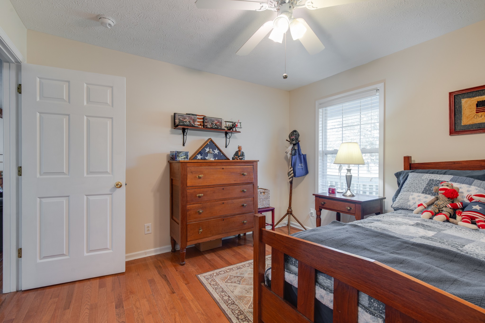 6699 East Benton Road Springfield, TN 37172 - Photo 36 of 66 a bedroom with a bed and wooden floor