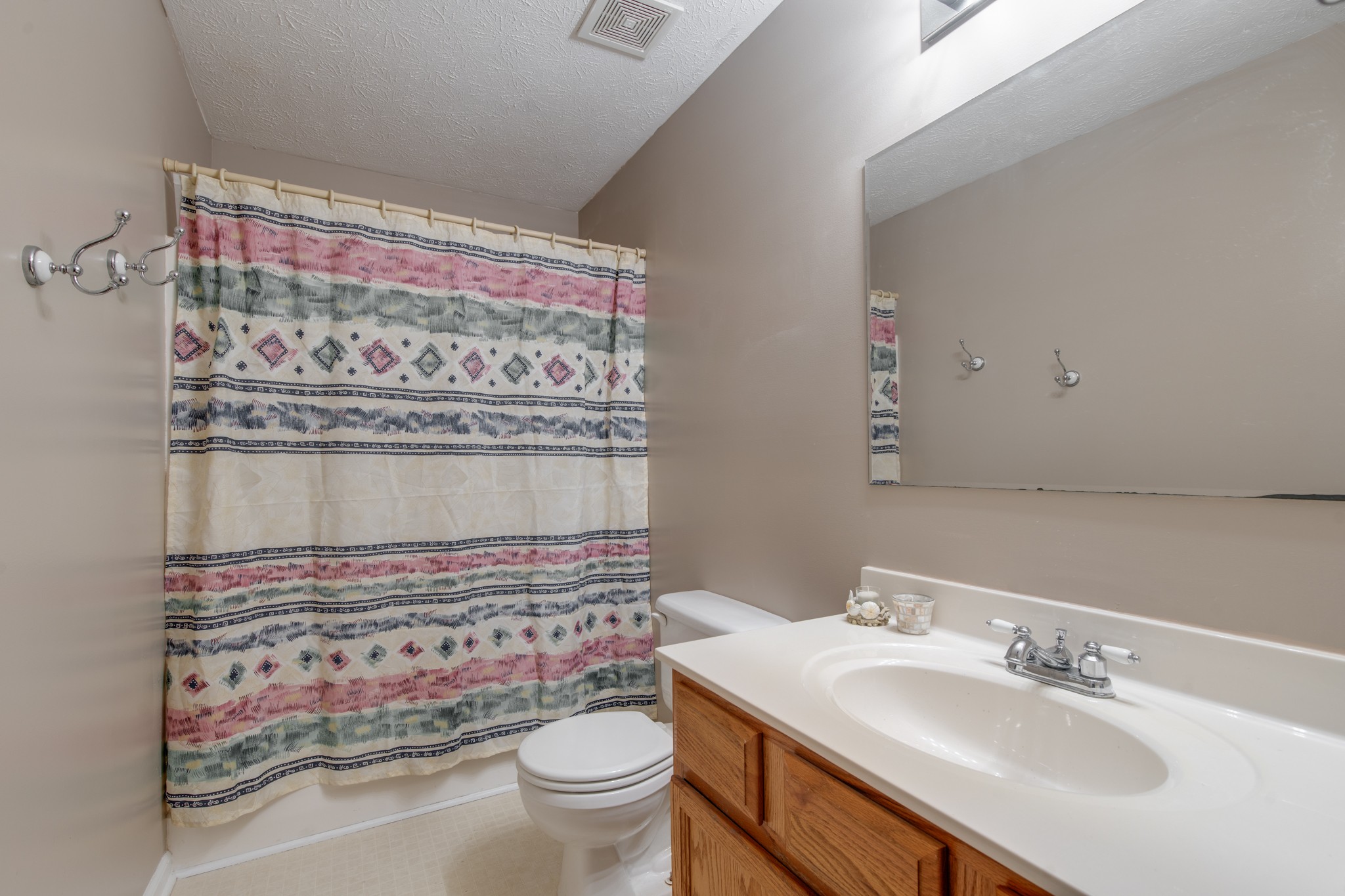 6699 East Benton Road Springfield, TN 37172 - Photo 39 of 66 a bathroom with a sink toilet and mirror