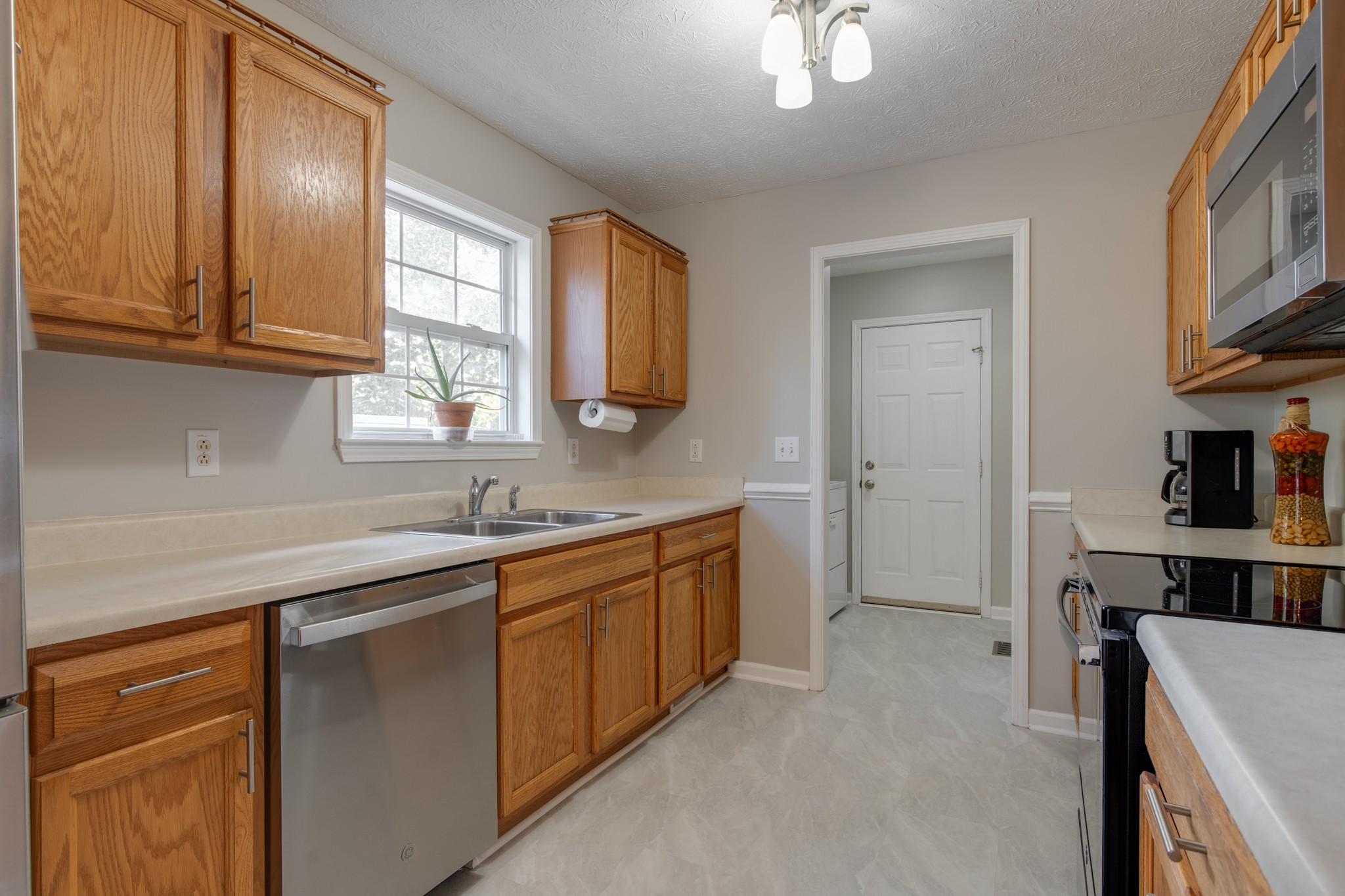6699 East Benton Road Springfield, TN 37172 - Photo 48 of 66 a kitchen with a sink cabinets and window