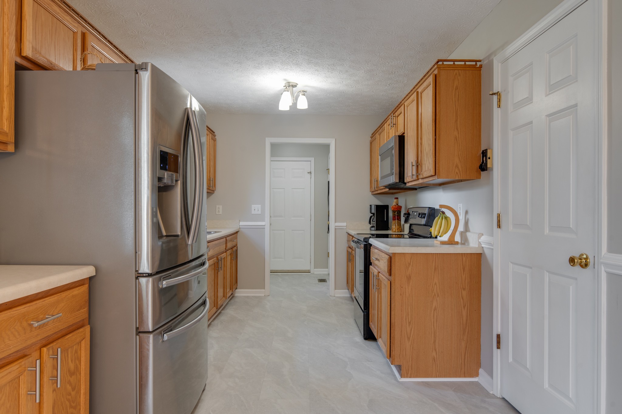 6699 East Benton Road Springfield, TN 37172 - Photo 50 of 66 a kitchen with stainless steel appliances granite countertop a refrigerator and a stove