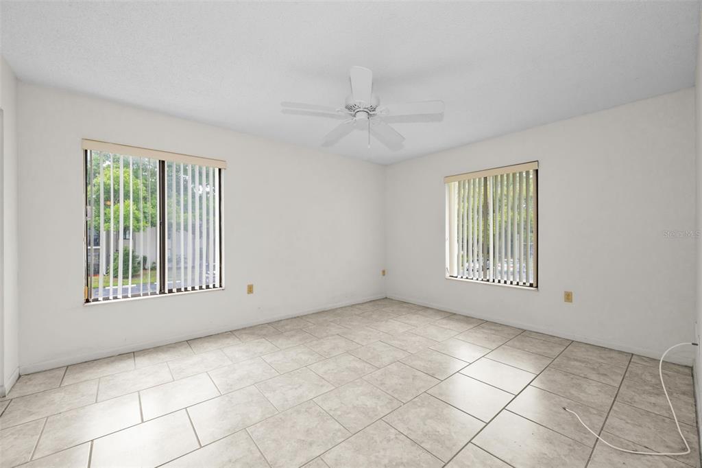 2687 Pine Ridge Way South, Unit B2 Palm Harbor, FL 34684 - Photo 20 of 68 a view of an empty room with a window
