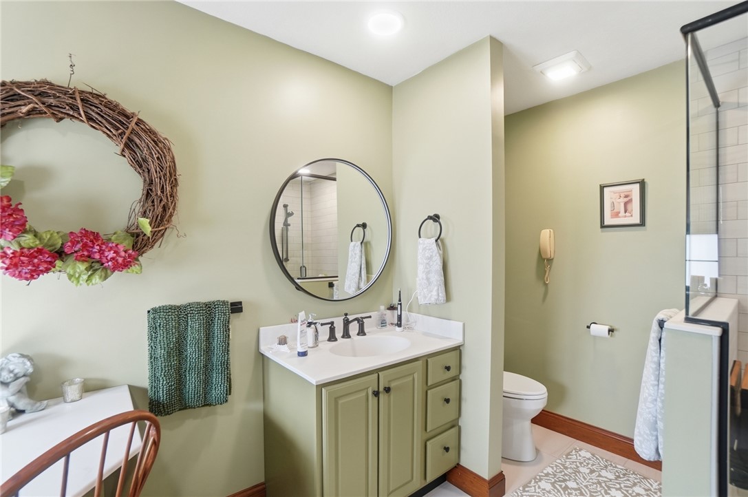 5300 Brookshire Lane Springfield, OH 45502 - Photo 31 of 56 This thoughtfully designed bathroom offers a tranquil retreat with practical elements.