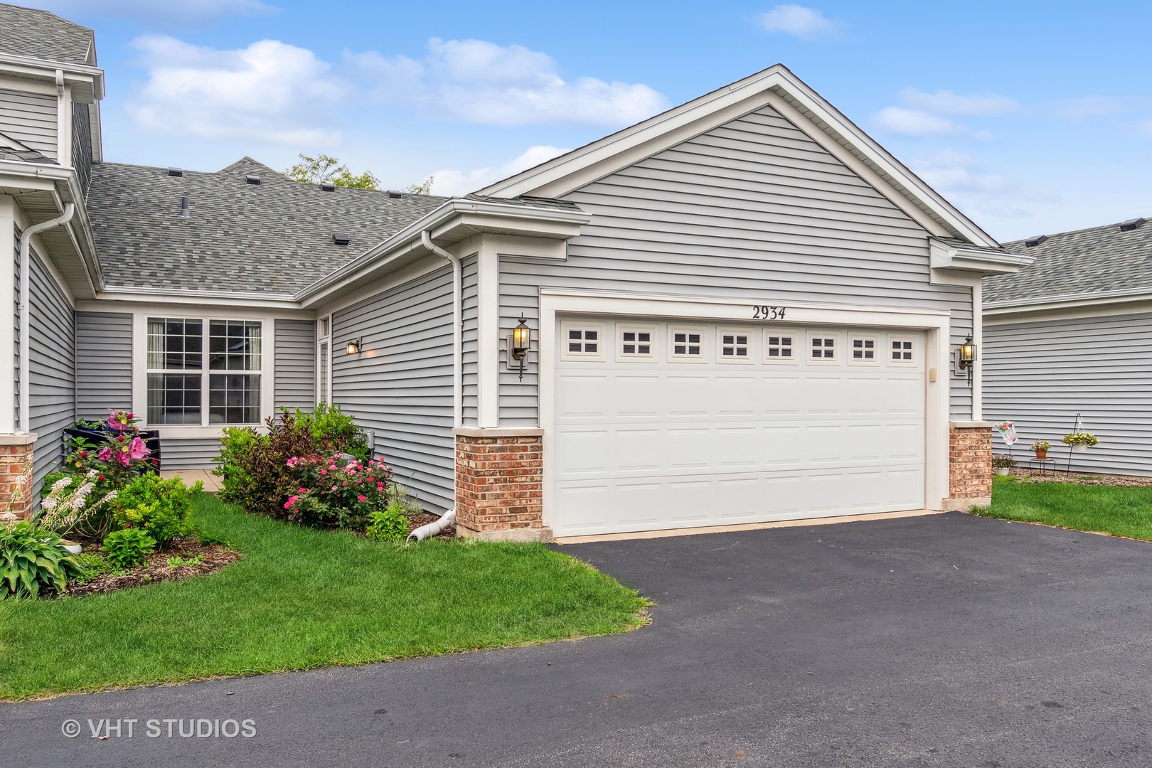 2934 Portage Street Naperville, IL 60564 - Photo 17 of 30 a view of a house with a small yard and a garage