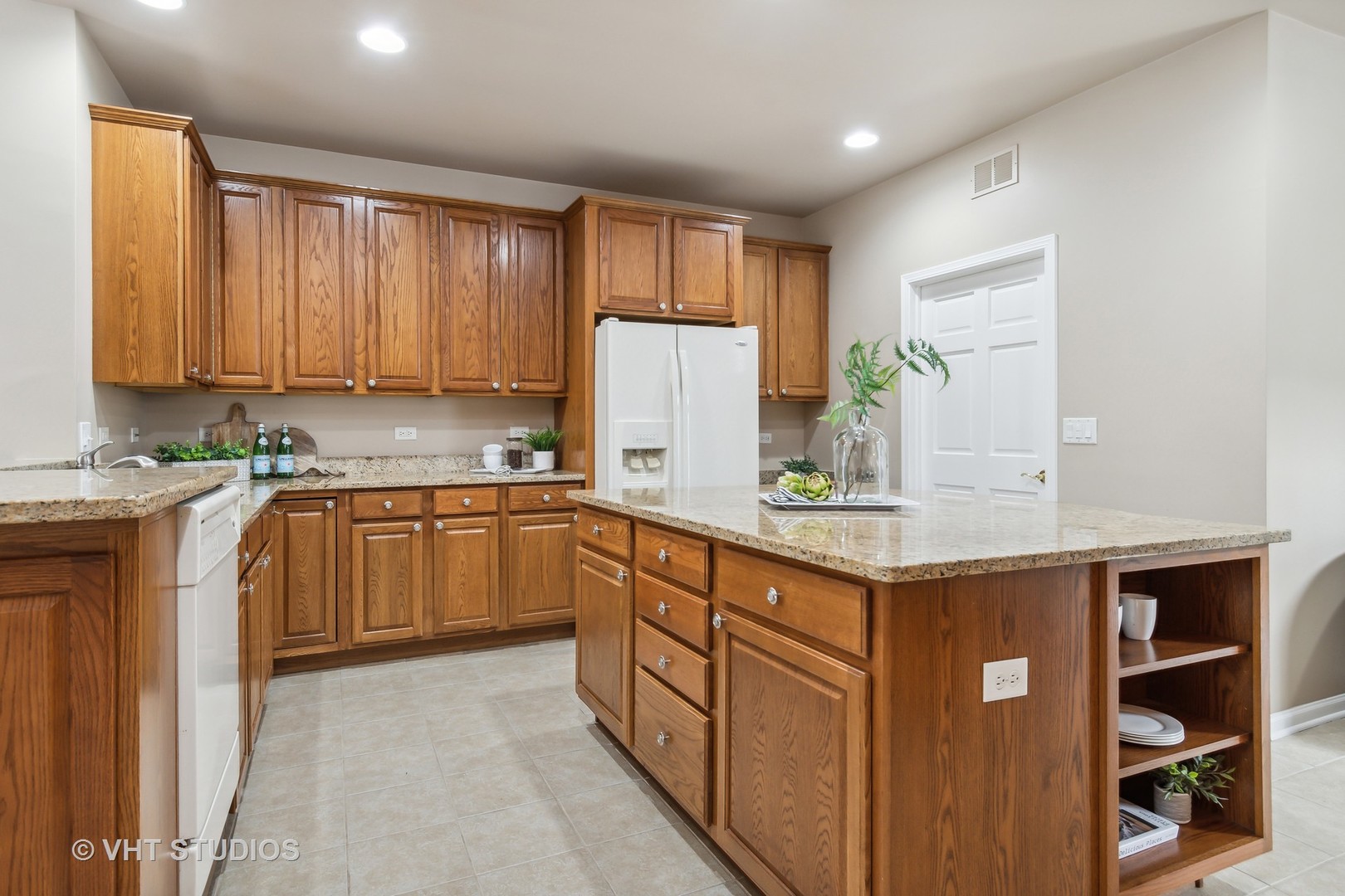 2934 Portage Street Naperville, IL 60564 - Photo 8 of 30 a kitchen with stainless steel appliances granite countertop wooden cabinets a refrigerator and a sink
