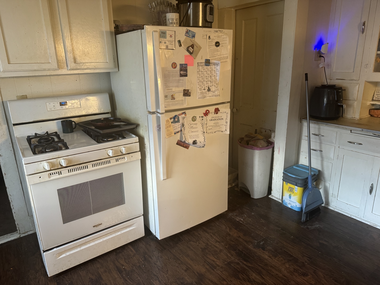 124 Central Street Atwood, IL 61913 - Photo 2 of 6 a white refrigerator freezer sitting inside of a kitchen