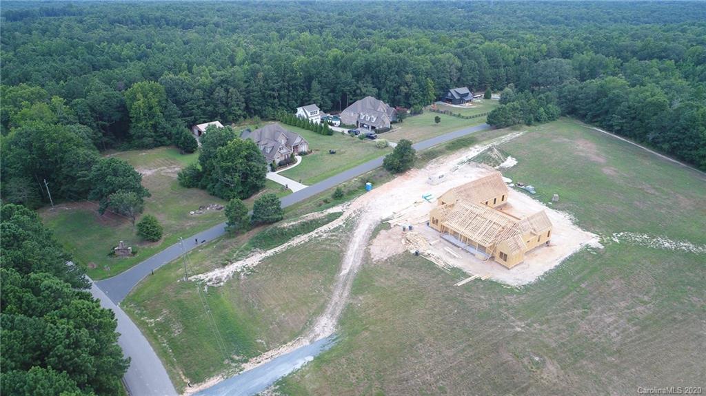 0 Niven Road, Unit LOT 5 Lancaster, SC 29720 - Photo 4 of 7 a view of a lake with a yard