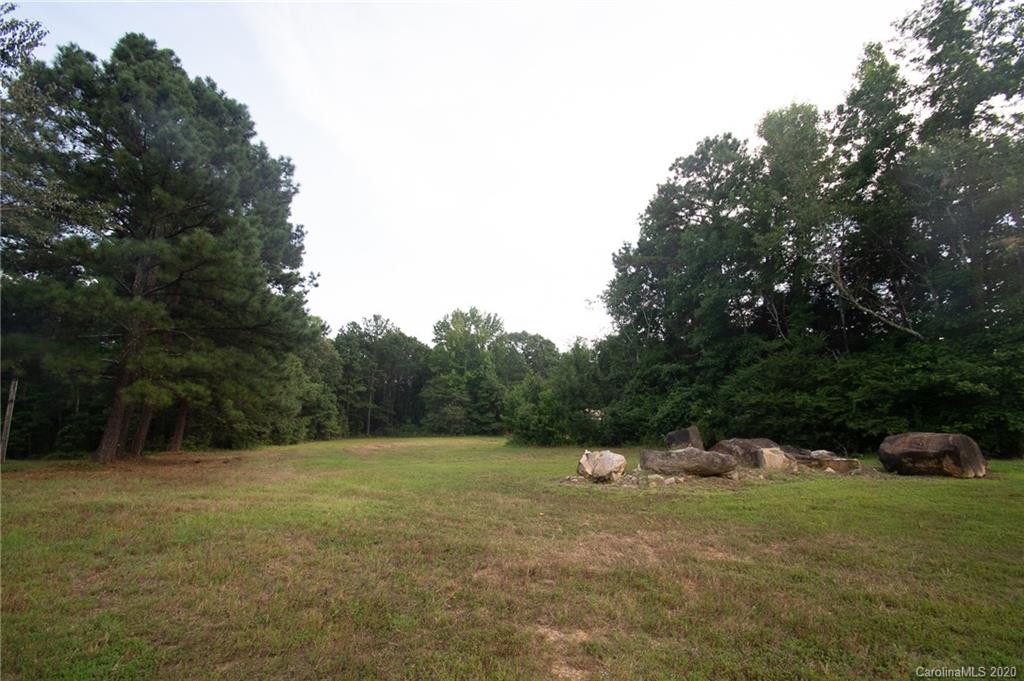 0 Niven Road, Unit LOT 5 Lancaster, SC 29720 - Photo 5 of 7 a backyard of a house with trees and plants