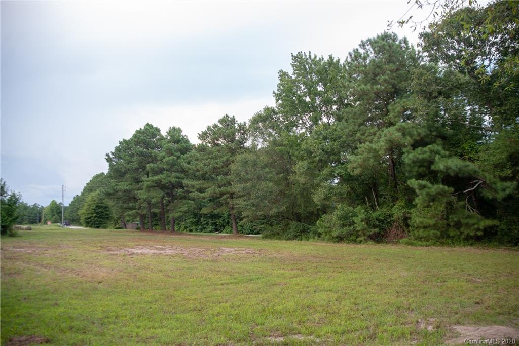 0 Niven Road, Unit LOT 5 Lancaster, SC 29720 - Photo 6 of 7 a view of a field with an trees