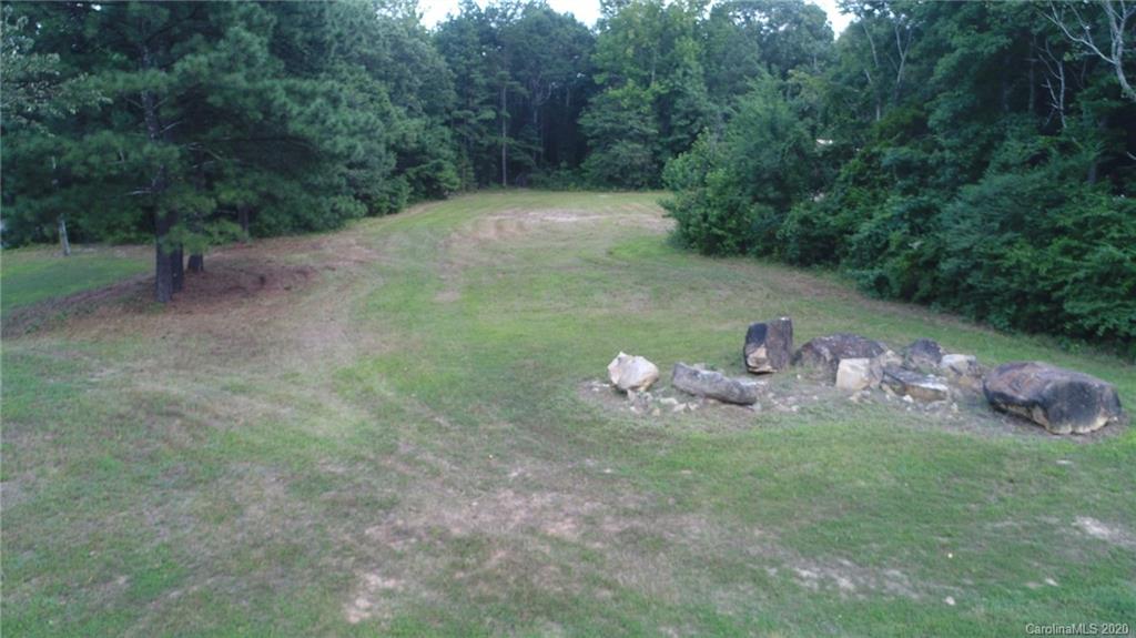 0 Niven Road, Unit LOT 5 Lancaster, SC 29720 - Photo 7 of 7 a view of a wooden house with a yard
