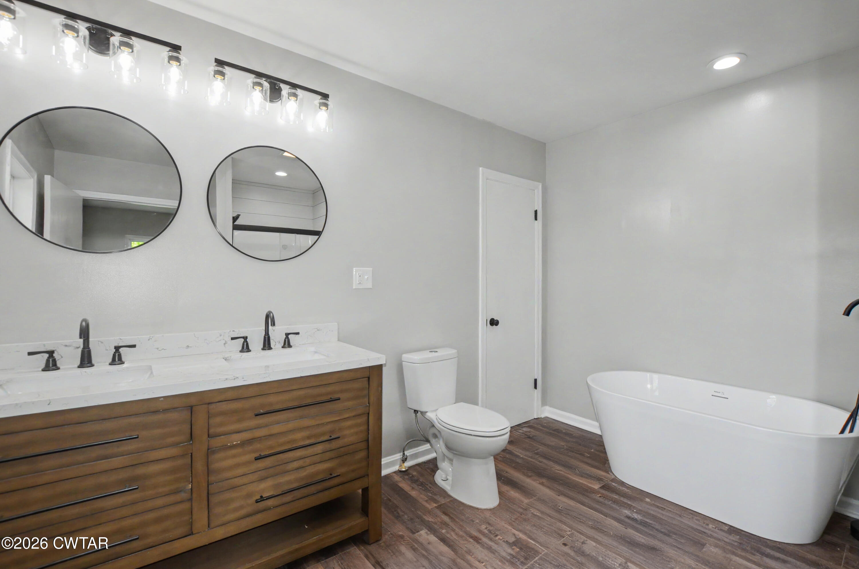 4177 Gum Flat Road Bells, TN 38006 - Photo 21 of 30 a bathroom with a toilet a sink and a mirror
