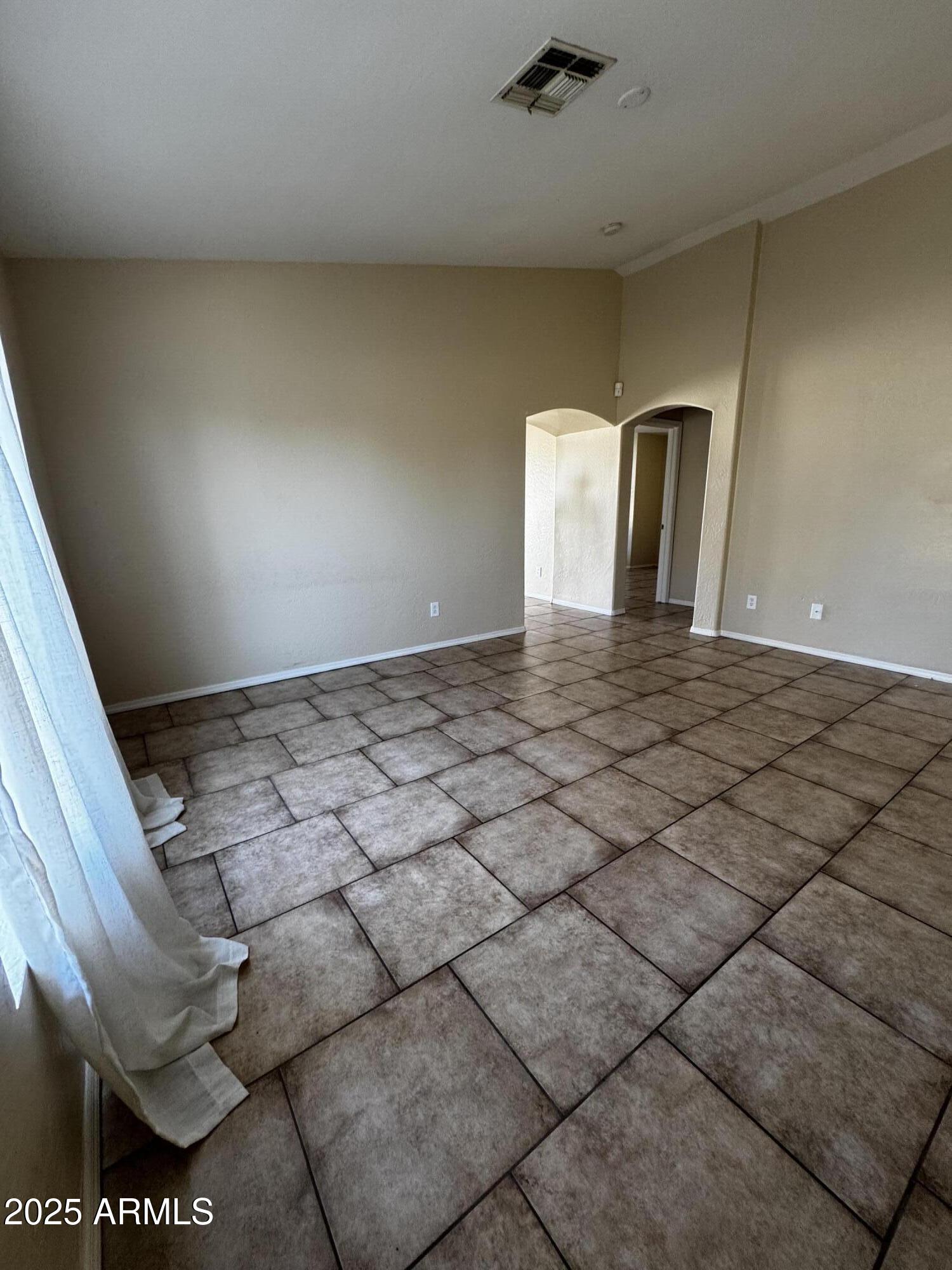 12817 North El Frio Street El Mirage, AZ 85335 - Photo 13 of 16 a view of a livingroom with a fireplace