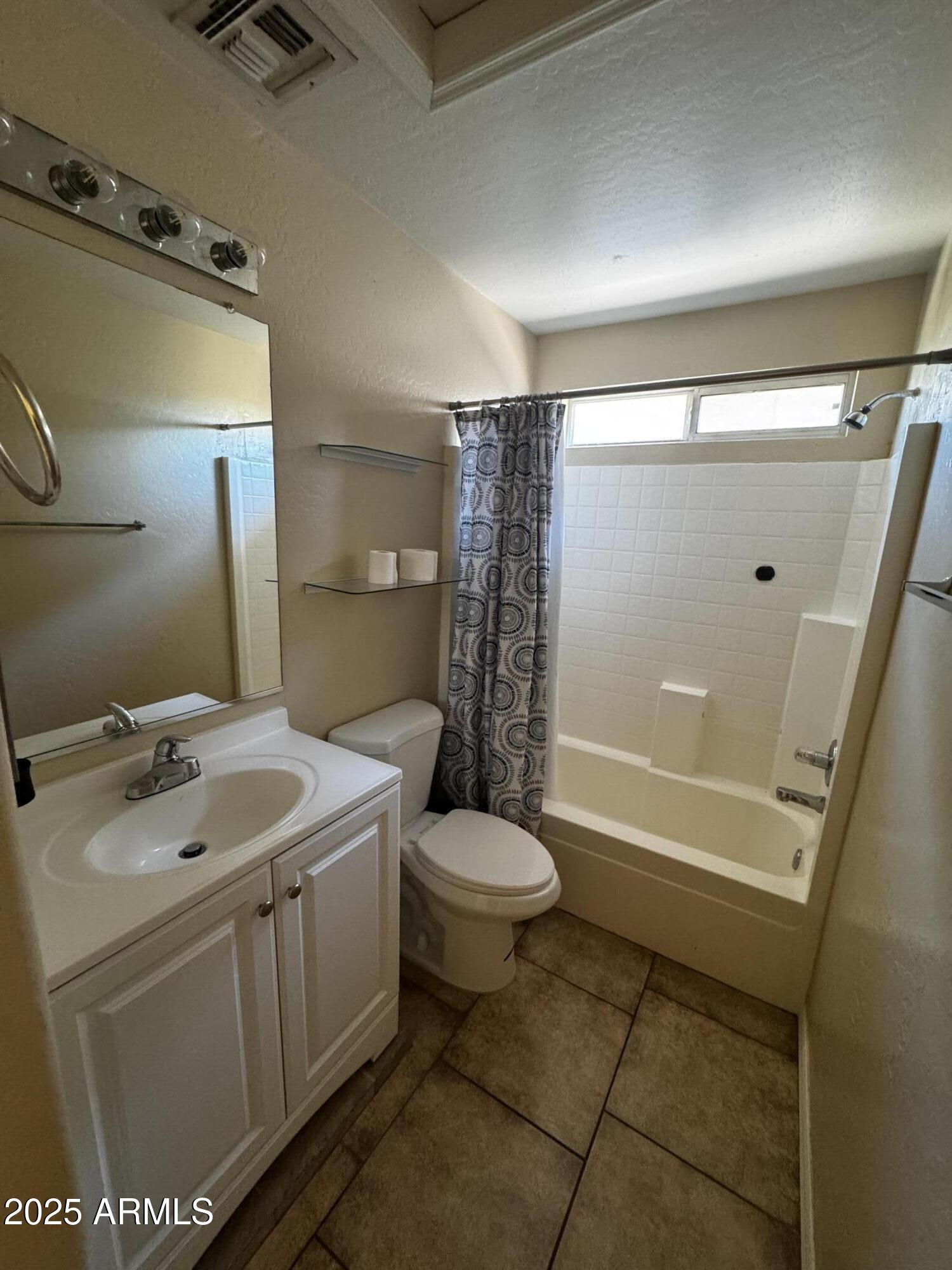 12817 North El Frio Street El Mirage, AZ 85335 - Photo 14 of 16 a bathroom with a sink toilet and shower
