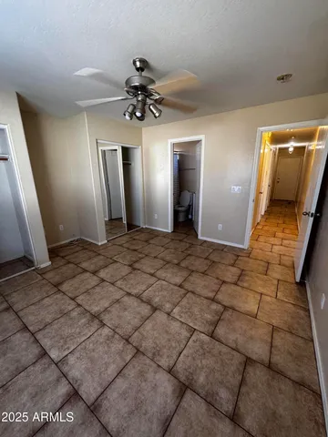 a view of a hallway with a chandelier