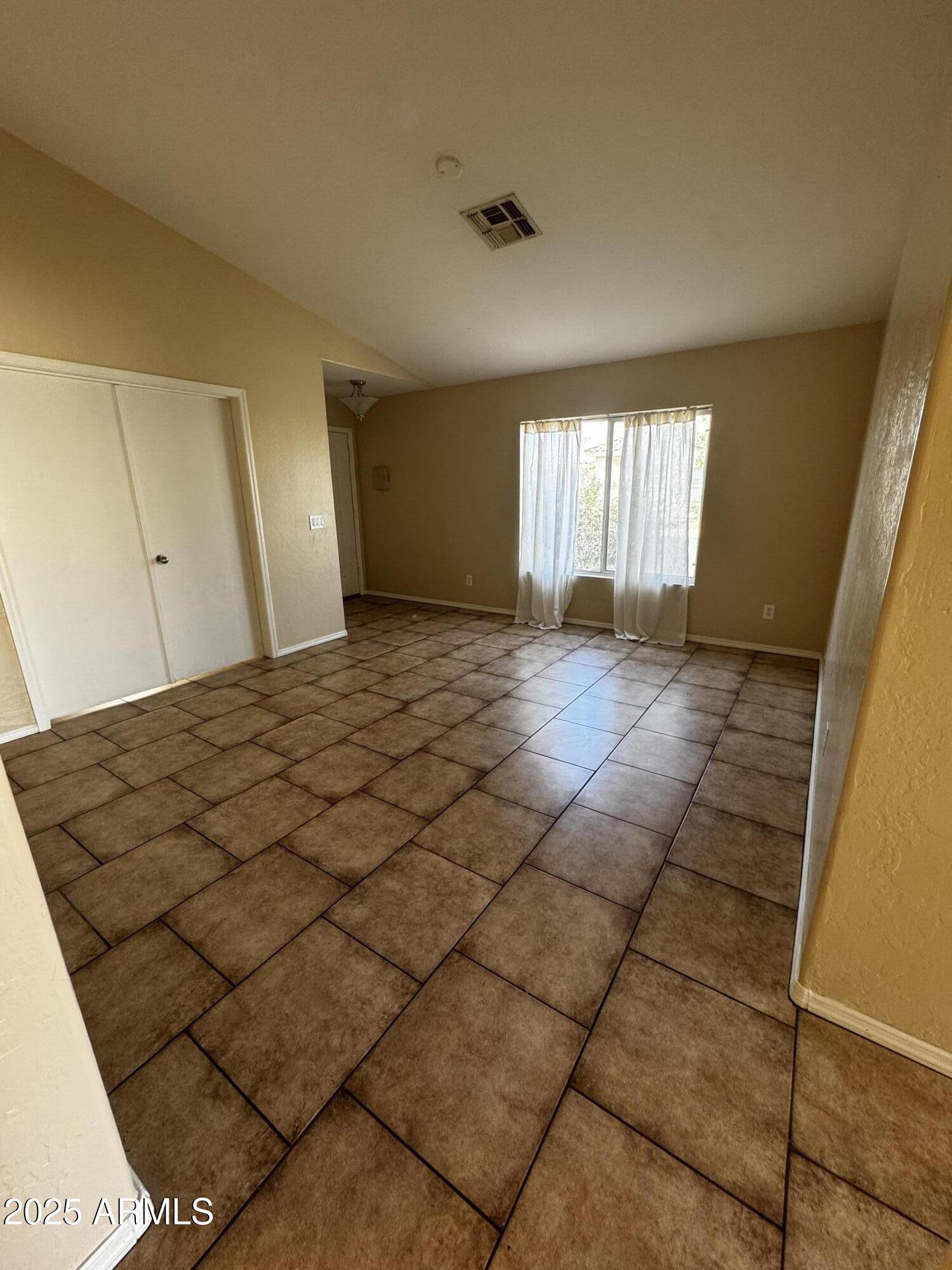 12817 North El Frio Street El Mirage, AZ 85335 - Photo 8 of 16 a view of a livingroom with a staircase