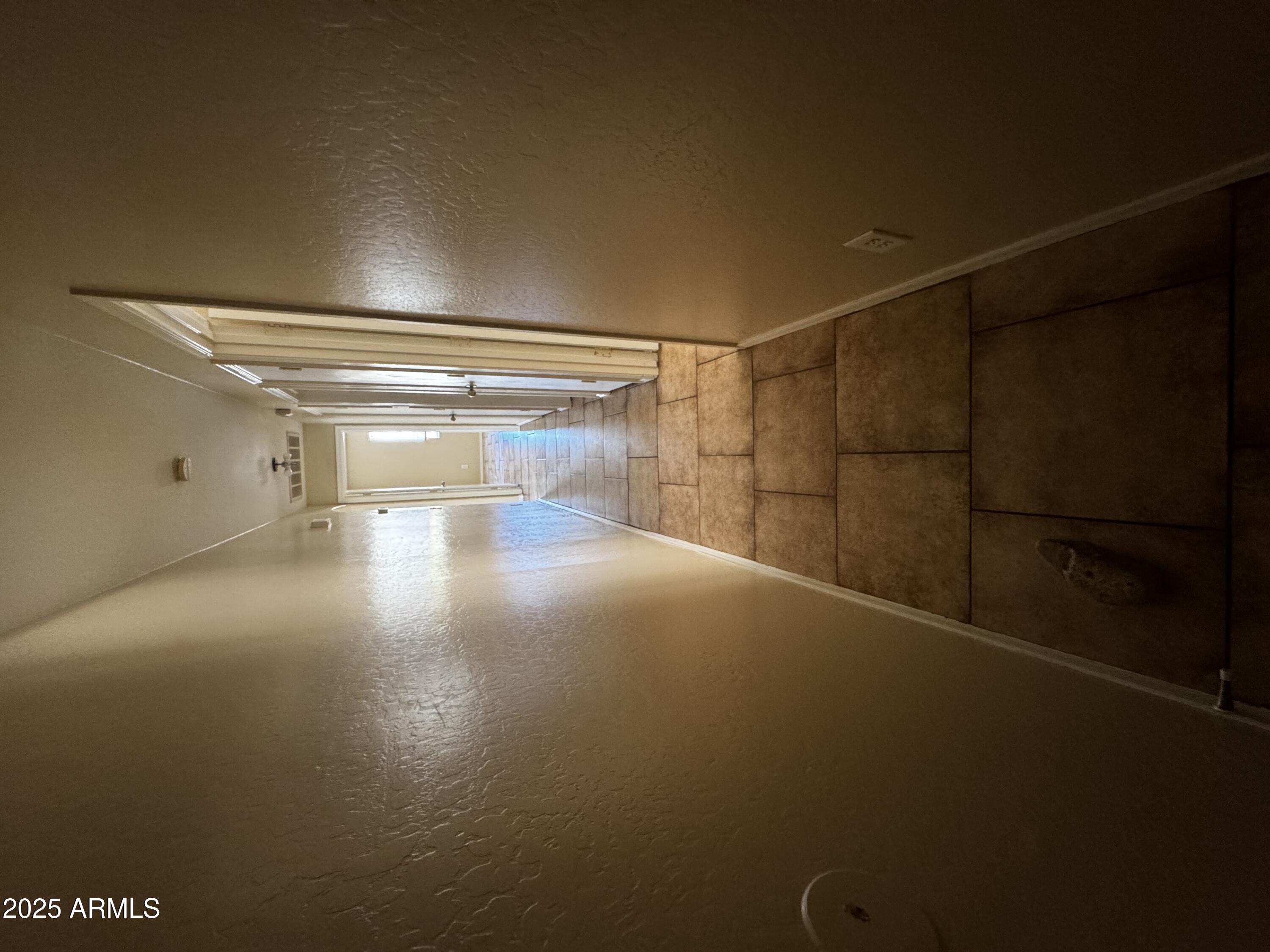 12817 North El Frio Street El Mirage, AZ 85335 - Photo 10 of 16 a view of a room with racks on the wall