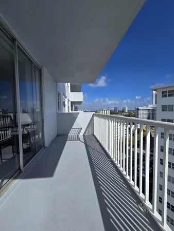 a view of balcony with furniture