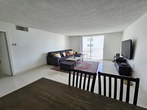 a bedroom with bed and wooden floor